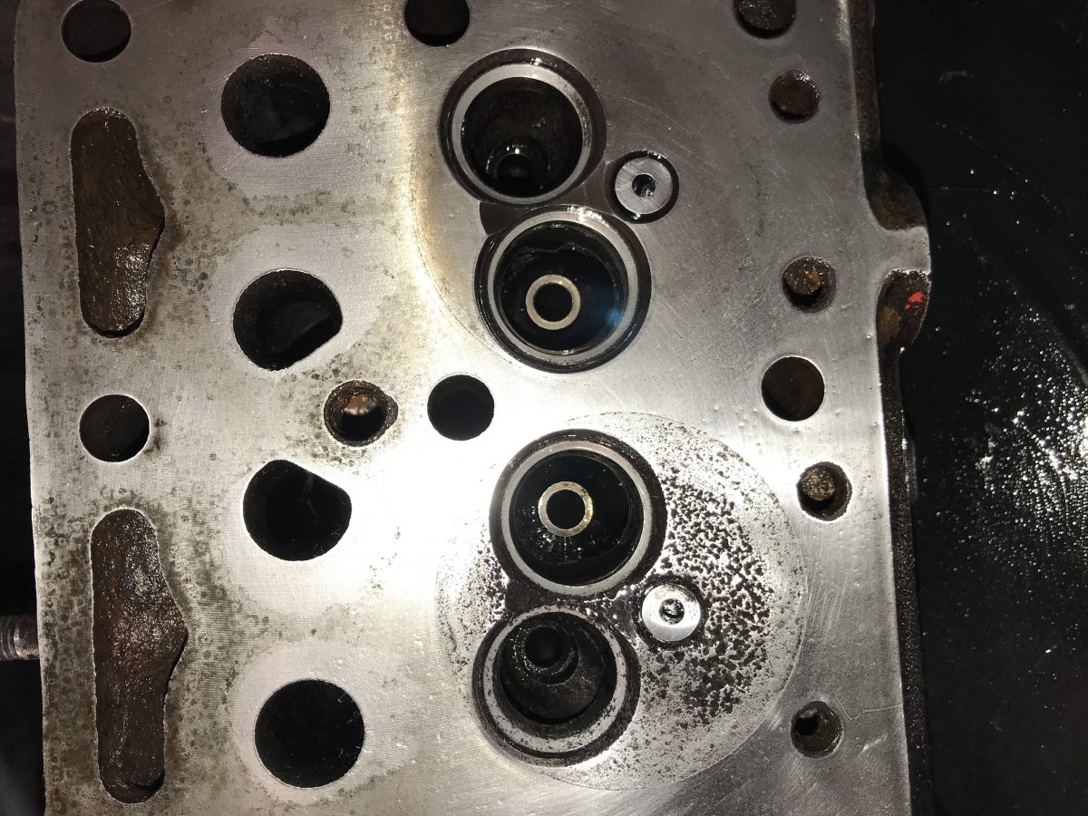 Cleaning the cylinder head and removing and grinding the valves ...